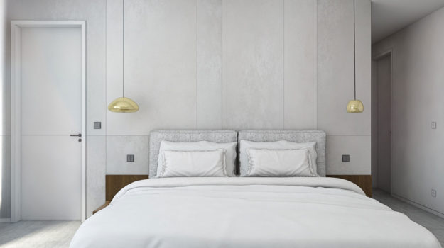Návrh minimalistickej spálne v bielo-sivých tónoch, útulnosť dodáva mäkký koberec, čalúnená posteľ a zlaté doplnky.